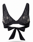 Black bikini top with glass beading elements on a white background
