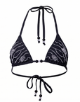 Black bikini top with floral patterns on a white background