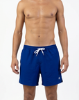 Man wearing blue swim shorts with a white drawstring. Image photographed  on a white background
